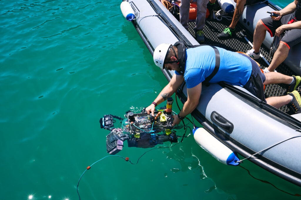 Students test their autonomous underwater vehicles in CMRE's basin at RAMI 2025.