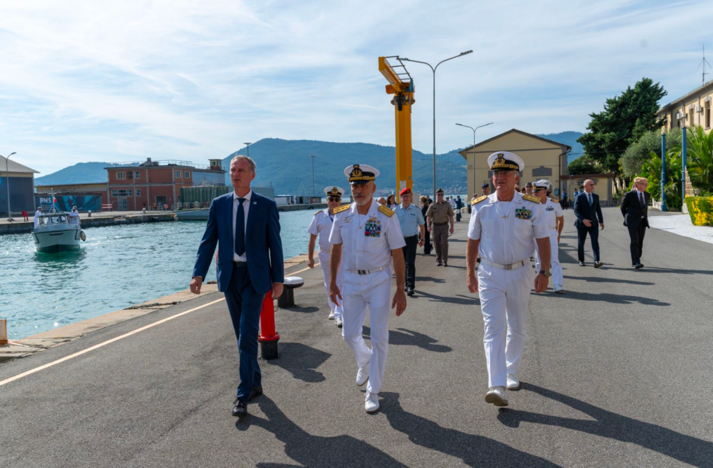 Admiral Giuseppe Cavo Dragone and Dr. Eric Pouliquen walk alongside CMRE's sea water basin, September 2025.